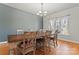 Inviting dining room featuring hardwood floors and natural light from the large window at 520 Steeple Chase Trl, Salisbury, NC 28144