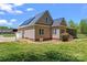 Exterior shot of home with metal roof, solar panels, and screened porch at 520 Steeple Chase Trl, Salisbury, NC 28144
