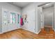 Bright foyer with hardwood floors, a decorative glass door, and a coat rack at 520 Steeple Chase Trl, Salisbury, NC 28144