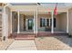 Inviting front porch with classic columns, brick steps, and a cozy bench at 520 Steeple Chase Trl, Salisbury, NC 28144