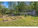 Large garden area with planting beds, a greenhouse, and a shed at 520 Steeple Chase Trl, Salisbury, NC 28144