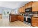 View of kitchen featuring stainless steel appliances and a dark countertop at 520 Steeple Chase Trl, Salisbury, NC 28144