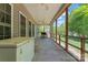 Spacious screened porch with ceiling fans and a view of the backyard at 520 Steeple Chase Trl, Salisbury, NC 28144