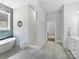 Luxurious bathroom featuring a modern tub, glass-enclosed shower, and elegant fixtures at 5933 Legacy Ln, Kannapolis, NC 28081