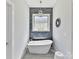 Stylish bathroom featuring a freestanding tub, decorative tile, and a modern chandelier at 5933 Legacy Ln, Kannapolis, NC 28081