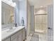 Well-lit bathroom featuring a spacious vanity, glass-enclosed shower, and modern finishes at 5933 Legacy Ln, Kannapolis, NC 28081