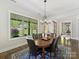 Formal dining room with large windows overlooking the landscaped backyard at 5933 Legacy Ln, Kannapolis, NC 28081