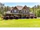 Beautiful stone home with a covered front porch and lush landscaping at 5933 Legacy Ln, Kannapolis, NC 28081