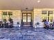Charming front porch with stone accents, decorative lanterns, and comfortable seating at 5933 Legacy Ln, Kannapolis, NC 28081