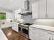 A gourmet kitchen with white cabinetry, marble countertops, and a professional-grade range at 5933 Legacy Ln, Kannapolis, NC 28081