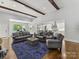 Open-concept living room, hardwood floors, and seamlessly connected to the kitchen at 5933 Legacy Ln, Kannapolis, NC 28081