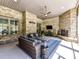 Inviting screened porch with comfortable seating, a ceiling fan, and a stone fireplace at 5933 Legacy Ln, Kannapolis, NC 28081