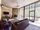 Relaxing screened porch with cozy seating, a stone fireplace, and serene views at 5933 Legacy Ln, Kannapolis, NC 28081