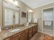 Spacious bathroom featuring double sinks with granite countertop and tiled floor in the water closet at 5935 Winburn Ln, Charlotte, NC 28226