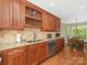 Gourmet kitchen featuring custom cabinetry, granite countertops, and stainless steel appliances at 5935 Winburn Ln, Charlotte, NC 28226