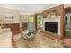 Living room boasts a fireplace, hardwood floors, and an open layout leading to the dining area at 5935 Winburn Ln, Charlotte, NC 28226