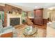 This living room features a brick fireplace, traditional decor, and a comfortable seating area at 5935 Winburn Ln, Charlotte, NC 28226