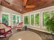 Sunroom with a wood ceiling, lots of windows and natural light provides serene relaxation at 5935 Winburn Ln, Charlotte, NC 28226