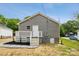 An expansive backyard features a well-maintained yard, a deck, and a door to the main house at 606 & 608 Hampton Rd, Lancaster, SC 29720