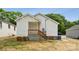 The backyard features a well-maintained yard, a porch, and a door to the main house at 606 & 608 Hampton Rd, Lancaster, SC 29720
