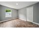 This cozy bedroom offers sleek hardwood floors, a built-in closet, and great natural light at 606 & 608 Hampton Rd, Lancaster, SC 29720