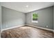 This bedroom features sleek hardwood floors, a built-in closet, and great natural light at 606 & 608 Hampton Rd, Lancaster, SC 29720