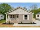 Charming home features a quaint covered porch and fresh landscaping at 606 & 608 Hampton Rd, Lancaster, SC 29720