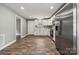 Open kitchen with stainless appliances, white cabinets, and wood-look floors, great for modern living at 606 & 608 Hampton Rd, Lancaster, SC 29720