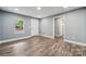 This bright living room features updated floors, and fresh paint at 606 & 608 Hampton Rd, Lancaster, SC 29720