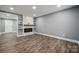 Spacious living room with modern fireplace, floating shelves and beautiful floors at 606 & 608 Hampton Rd, Lancaster, SC 29720