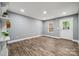 Bright living room boasts fresh paint, updated floors, and natural light at 606 & 608 Hampton Rd, Lancaster, SC 29720