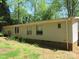 The house has neutral siding and a brick foundation; natural light streams through the multiple windows at 6293 Karen Dr, Claremont, NC 28610