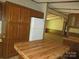 Cozy kitchen features a refrigerator, wooden cabinetry, and a butcher block island, blending functionality and style at 6293 Karen Dr, Claremont, NC 28610
