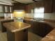 The kitchen features wood cabinets, countertops, and an island, providing ample storage and workspace at 6293 Karen Dr, Claremont, NC 28610