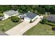 Aerial view of a home featuring a long driveway and a well-maintained front lawn at 7018 Huntsmaster Dr, Charlotte, NC 28277