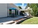 Outdoor patio area featuring a table, chairs, grill, and sliding glass door for seamless indoor/outdoor living at 7018 Huntsmaster Dr, Charlotte, NC 28277