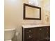 Bathroom features a marble countertop, dark wood vanity, and modern mirror at 7018 Huntsmaster Dr, Charlotte, NC 28277