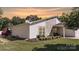 The house has stone accents, a well-manicured lawn, and an inviting front yard at 7018 Huntsmaster Dr, Charlotte, NC 28277