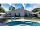 Beautiful backyard oasis featuring swimming pool, hot tub, and lounge seating at 7018 Huntsmaster Dr, Charlotte, NC 28277