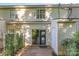 Back patio features a sliding glass door, storage and green plants providing a relaxing space at 7607 Petrea Ln, Charlotte, NC 28227