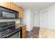 Kitchen featuring black appliances, granite countertops and wooden cabinets at 7607 Petrea Ln, Charlotte, NC 28227