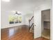 Bright living room with wood floors, staircase and windows with views of the neighborhood at 7607 Petrea Ln, Charlotte, NC 28227