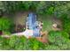 Breathtaking aerial view showcasing the home, deck, fire pit and lush greenery surrounding the property at 812 Timber Creek Dr, York, SC 29745