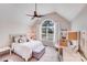 Bright, airy bedroom with vaulted ceiling, decorative wallpaper, and a large arched window at 812 Timber Creek Dr, York, SC 29745