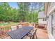 Outdoor deck with ample space for outdoor dining and entertaining, surrounded by lush greenery at 812 Timber Creek Dr, York, SC 29745