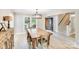 Dining room showcases a wooden table, chairs, chandelier and access to the stairs and front entrance at 812 Timber Creek Dr, York, SC 29745