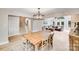 Dining room features a wooden table, chairs, chandelier and is adjacent to a cozy living room at 812 Timber Creek Dr, York, SC 29745