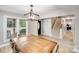 Dining room featuring a light fixture, wood table, chairs, and views of the front yard at 812 Timber Creek Dr, York, SC 29745