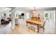 Open-concept dining room with hardwood floors, leads to living room with fireplace at 812 Timber Creek Dr, York, SC 29745