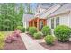 Charming home with natural wood porch, inviting walkway and lush landscaping at 812 Timber Creek Dr, York, SC 29745